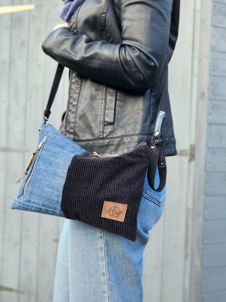 Blue/Black Crossbody SOLD OUT Small denim crossbody bag worn on shoulder with dark corduroy panel and compact shape