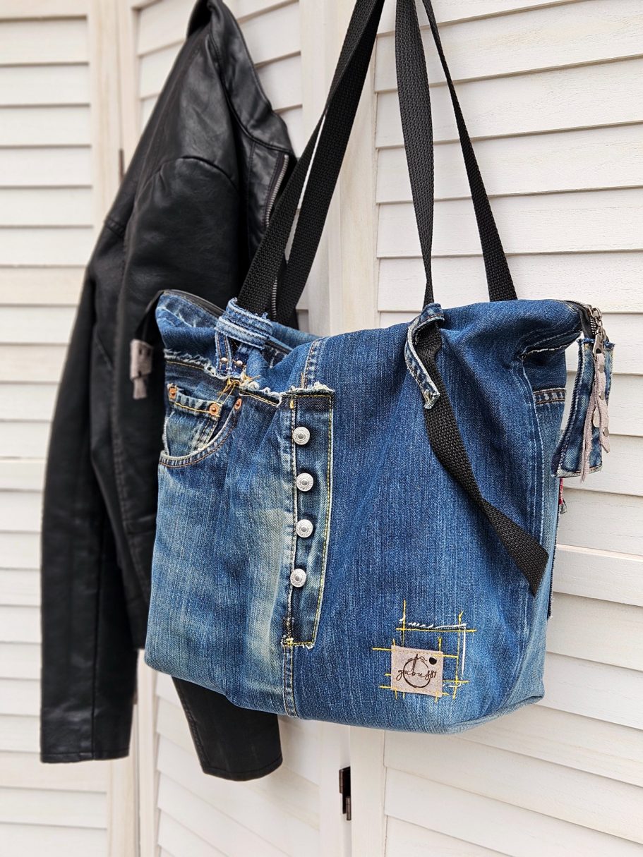 Handmade Denim Tote with Attitude Handmade denim tote bag worn on the shoulder made from upcycled jeans with original pocket detail