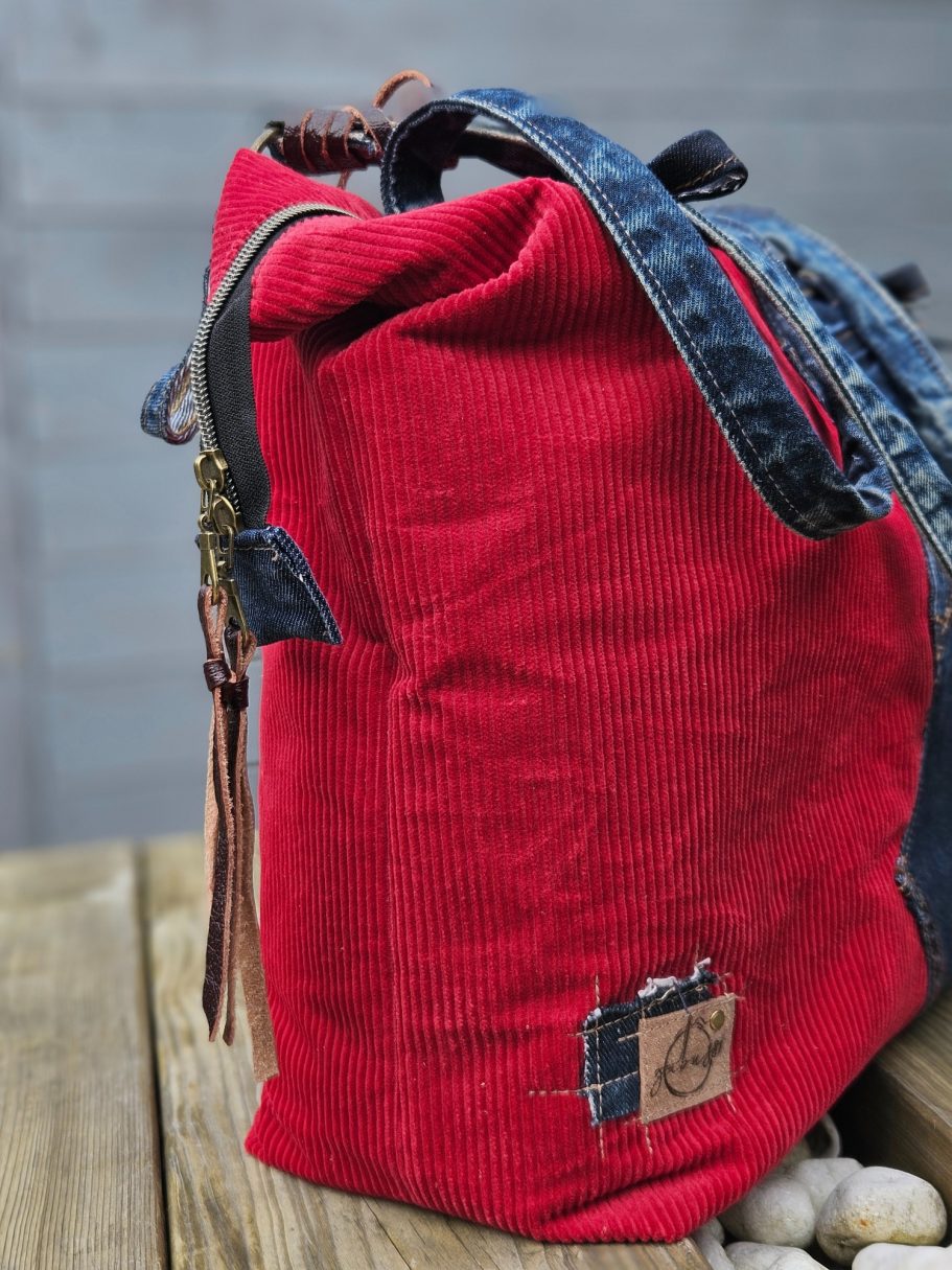 Details with logo on red handmade bag