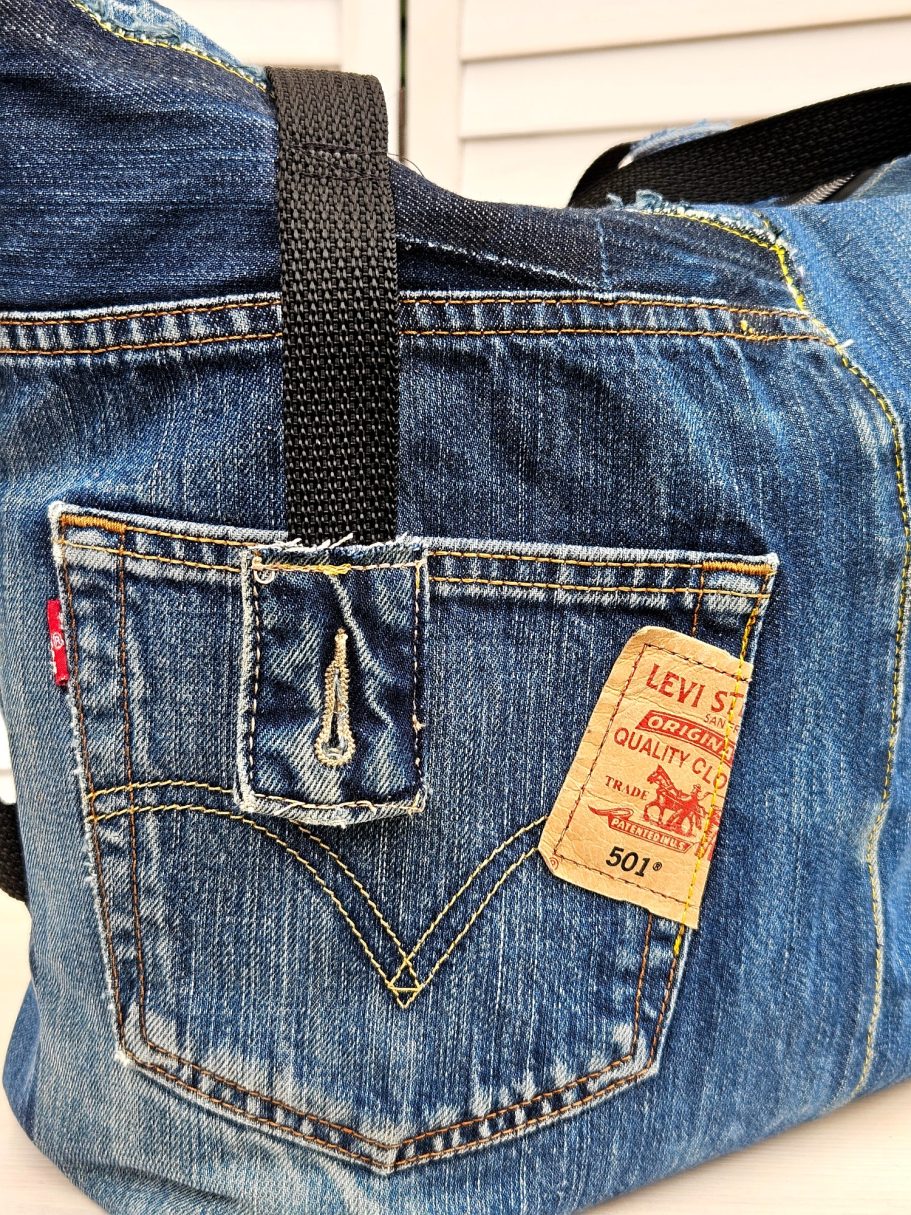 Handmade Denim Tote with Attitude Close up of denim tote bag front made from reclaimed jeans with original pocket and button detail