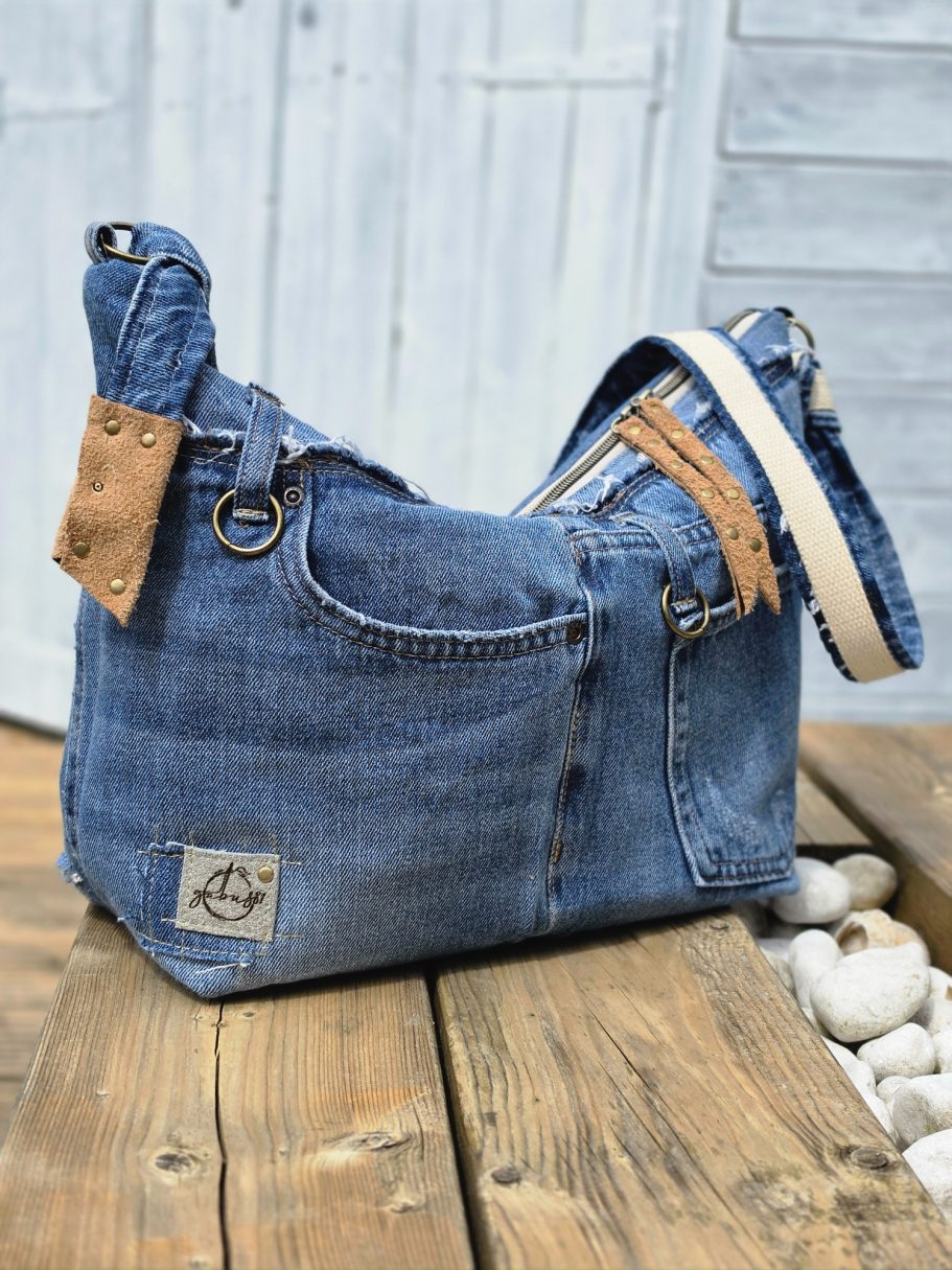 New in Shop Large reclaimed denim shoulder bag with original jeans details, double zip closure and adjustable crossbody strap.