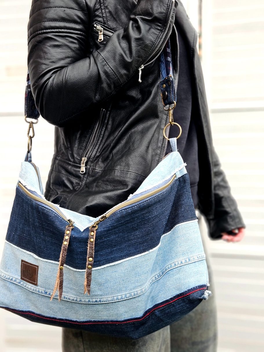 Patchwork Denim Shoulder Bag Blue denim shoulder bag with patchwork pockets, double zip closure and black leather strap.