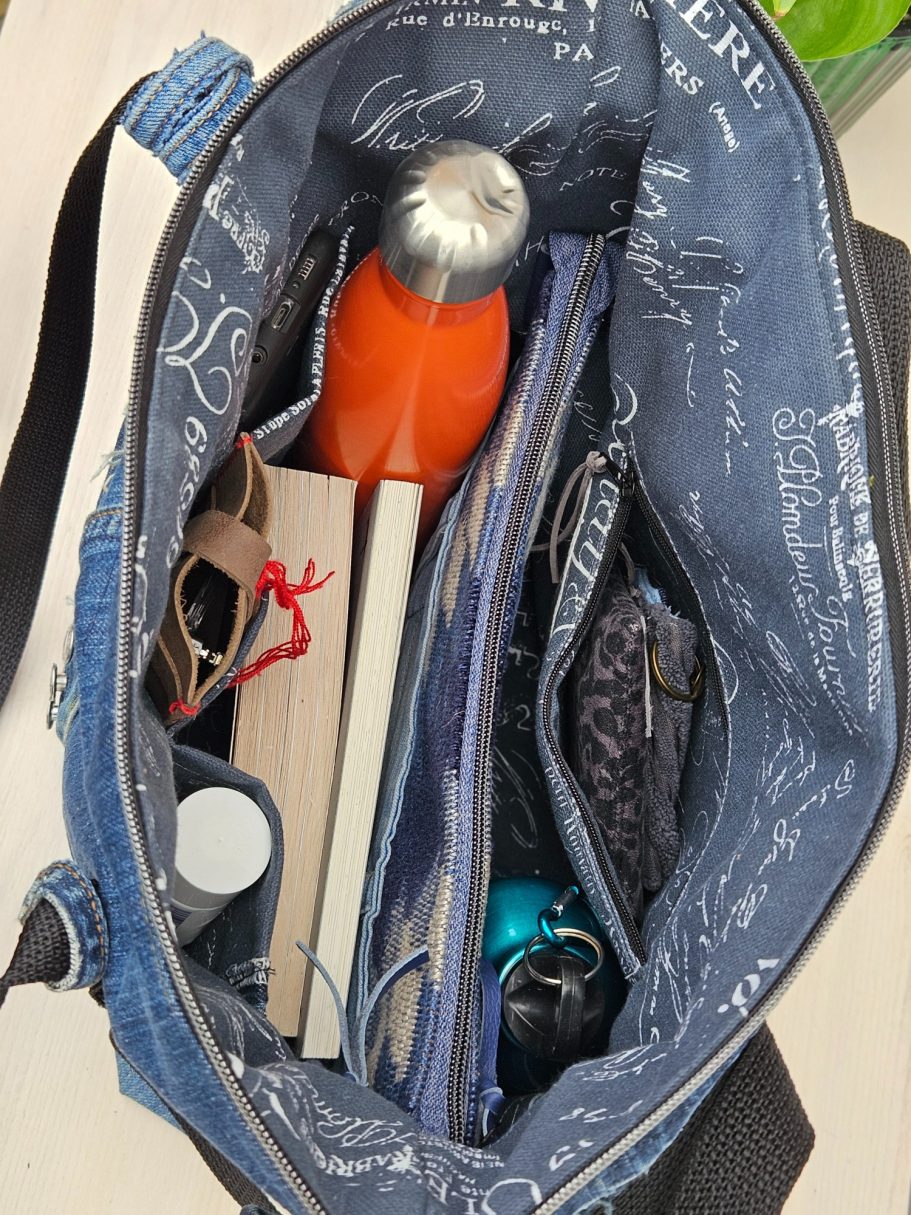 Handmade Denim Tote with Attitude Inside of large denim tote bag with zip closure, pockets, notebook, water bottle and everyday essentials